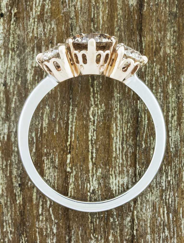 three-stone cognac diamond engagement ring, rose gold basket and platinum band