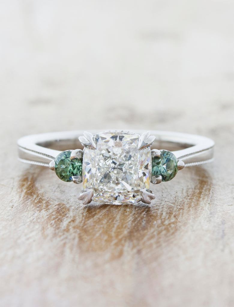 Cushion Cut Three Stone Diamond Ring with Montana Sapphires. caption:set with 1.85ct cushion diamond