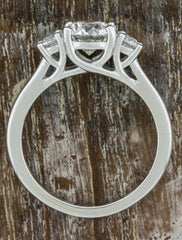 three stone diamond engagement ring, heart shaped setting