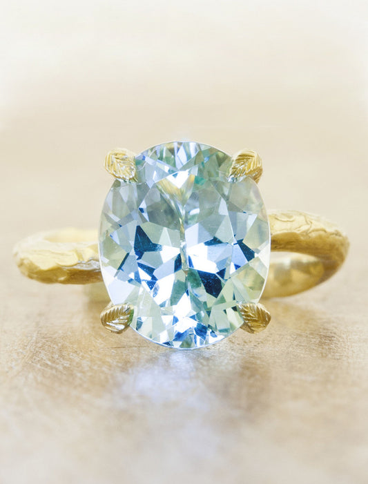 caption:Shown with oval aquamarine in yellow gold