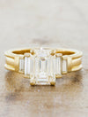 caption:Shown with a 2ct emerald cut center stone in 14k yellow gold