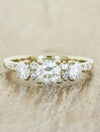 caption:Customized with 0.70ct round diamond & round side stones in 14k yellow gold