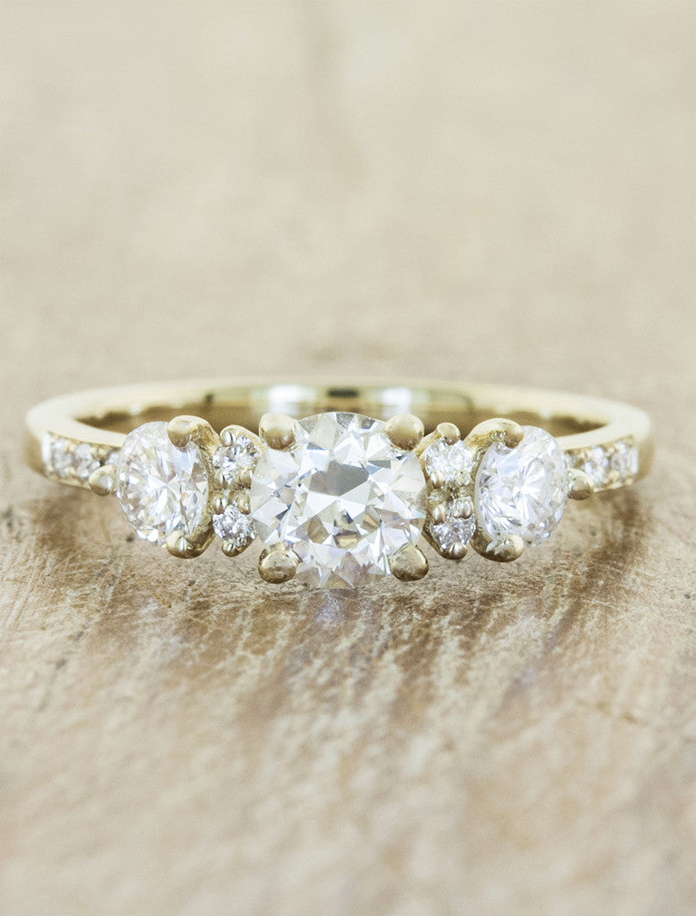 caption:Customized with 0.70ct round diamond & round side stones in 14k yellow gold