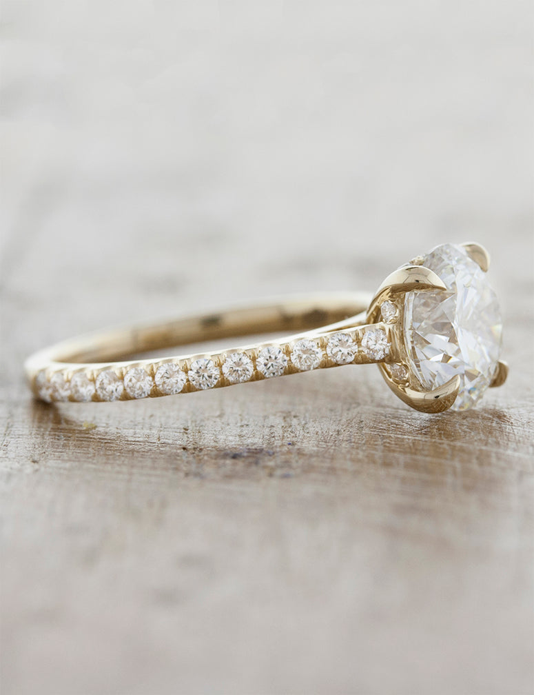 Solitaire with pave diamond band;caption:Pictured in 14k Yellow Gold