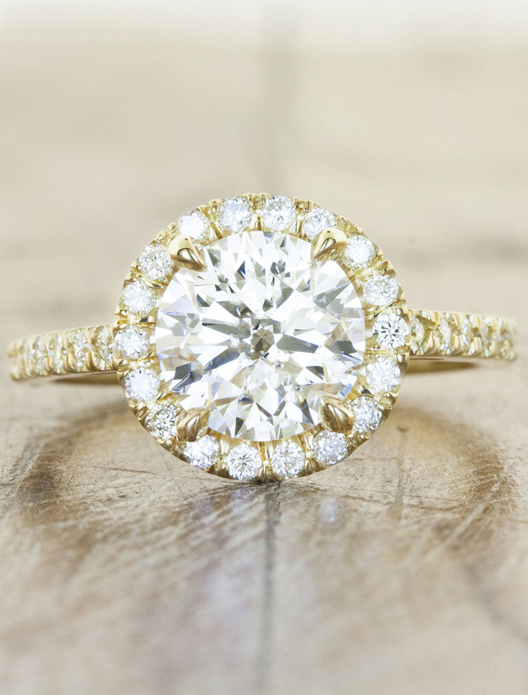 Round diamond halo engagement ring. caption:Shown with an 1.5ct diamond, set in 14k yellow gold