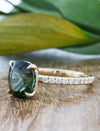caption: Shown with 2ct oval green sapphire in 14k yellow gold 