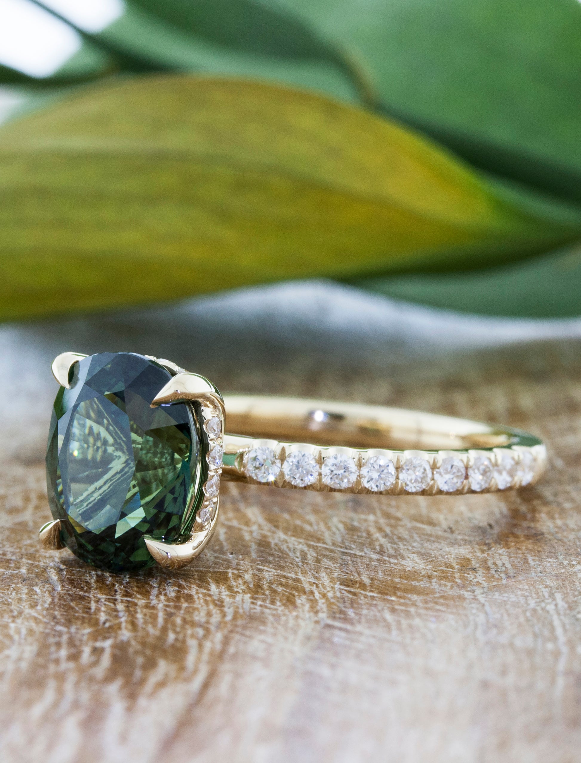 caption: Shown with 2ct oval green sapphire in 14k yellow gold 