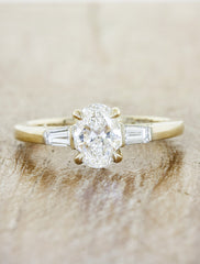 three stone oval diamond yellow gold ring, baguette accents;caption:Customized with an 1.00ct. Oval Diamond 14k Yellow Gold