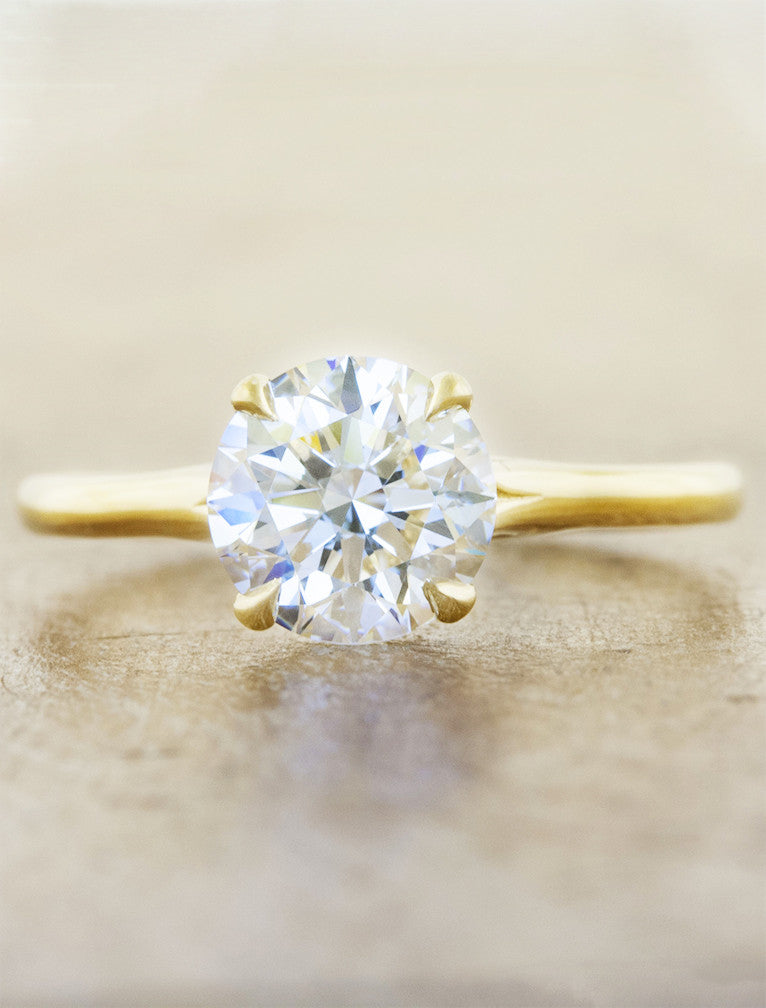 caption:Shown with 1.2ct round diamond in 14K yellow gold