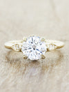 caption:Shown with 1.20ct round diamond in 14k yellow gold with 4 leaf prongs