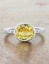 caption:Shown with oval yellow sapphire in platinum