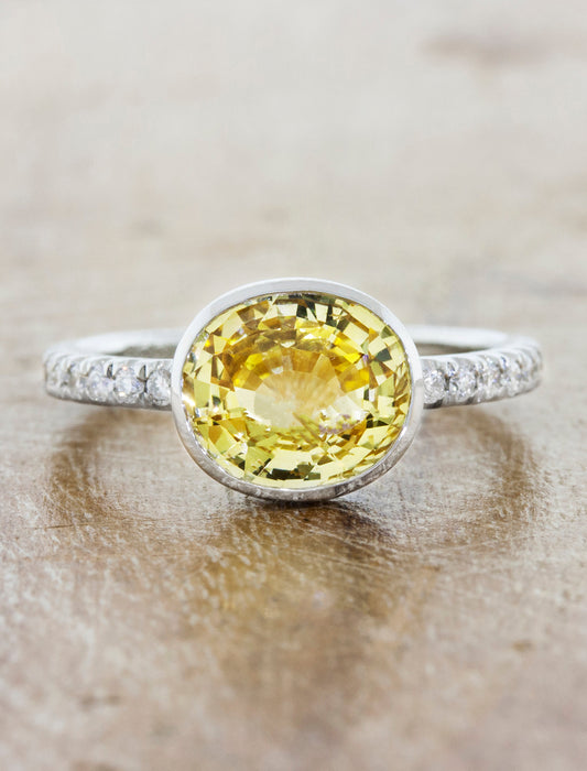 caption:Shown with oval yellow sapphire in platinum