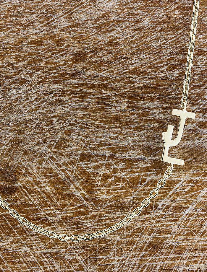 caption:Custom interlocking letter option - "J" & "L" letters in 14k yellow gold