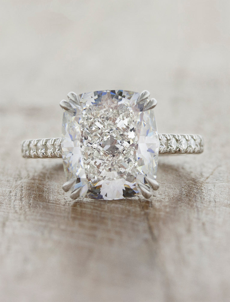 caption:Shown with 5ct cushion cut diamond in platinum
