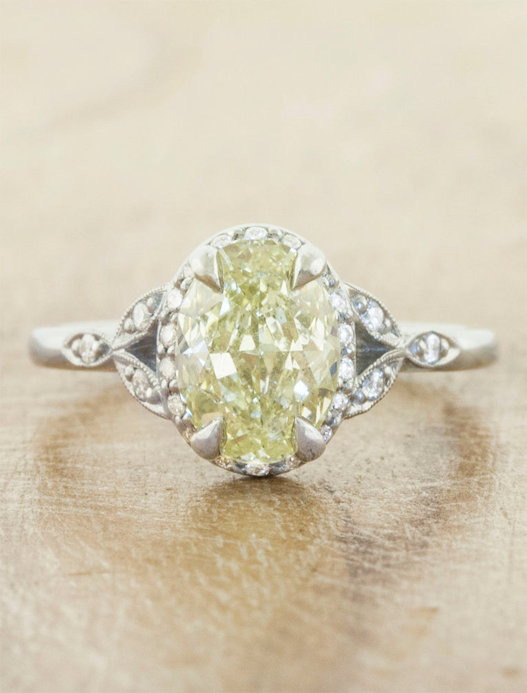 caption:Shown in platinum with a 1.5ct oval yellow diamond