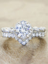 v-shaped diamond wedding band with paired engagement ring