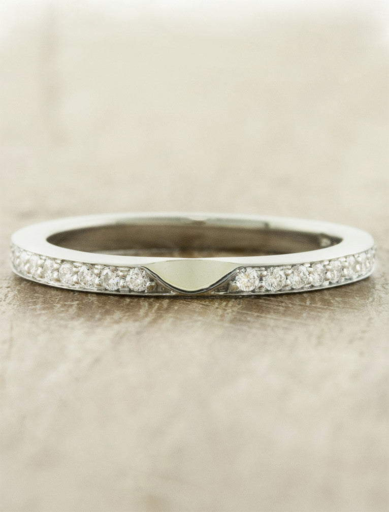 classic 1.8mm wide diamond wedding band. caption:Customized with a dip in the middle of ring.