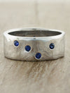 caption:Customized with blue sapphires in platinum