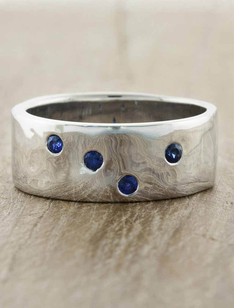 caption:Customized with blue sapphires in platinum