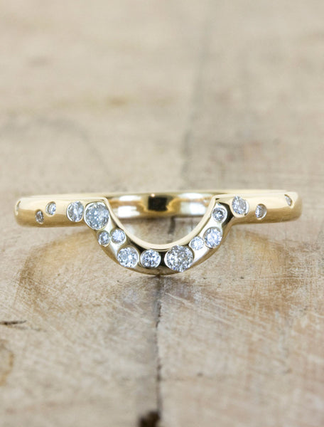 half circle yellow gold wedding bands sprinkled with diamonds