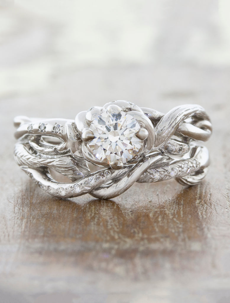 diamond engagement ring with twisting wedding band with leaf detailing