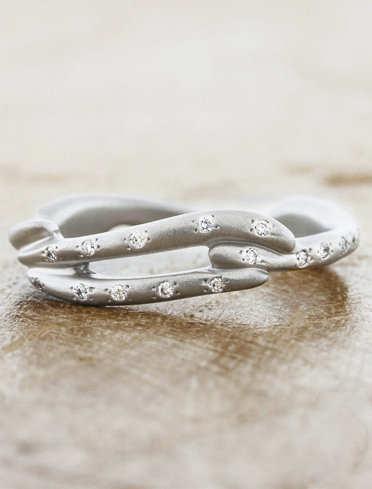 sculptural split shank organic shaped wedding band with diamonds. caption:Shown in sandblast finish 