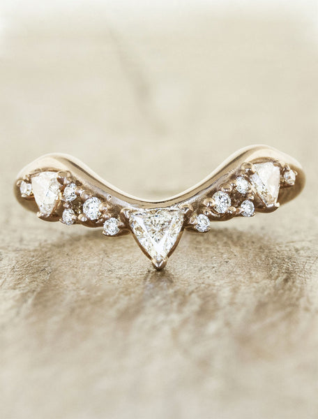 intricate wedding ring with trillion diamonds