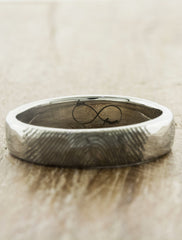 custom fingerprint wedding ring. caption:Shown with a custom engraving inside.