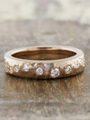caption:14k rose gold in 4mm width, polished finish & hammered texture