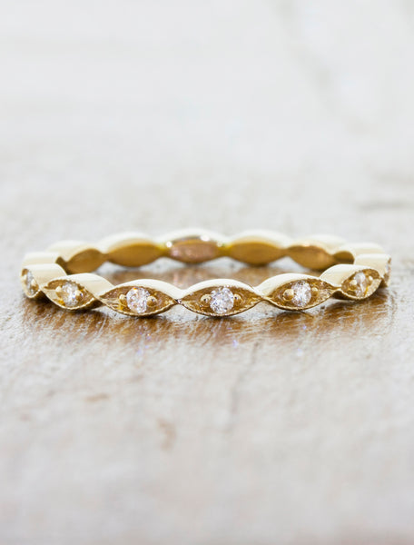 intricate diamond studded wavy gold wedding band