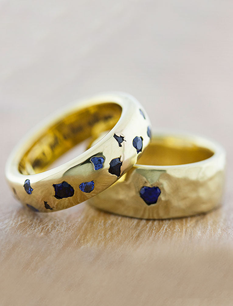 matching set of wedding bands in yellow gold studded with sapphires