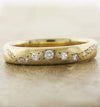 caption:14k yellow gold in 4mm width, brushed finish & hammered texture